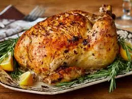 🍗 Best Chicken Recipes – Easy, Juicy, and Full of Flavor 1 chicken served with vegetables and lemon slices on a white plate”